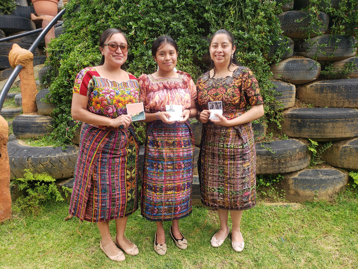 Melissa who was our muse for the Guatemala studs. She recieved her very own pair. and shared the moment in a photo with her teachers. she is very proud